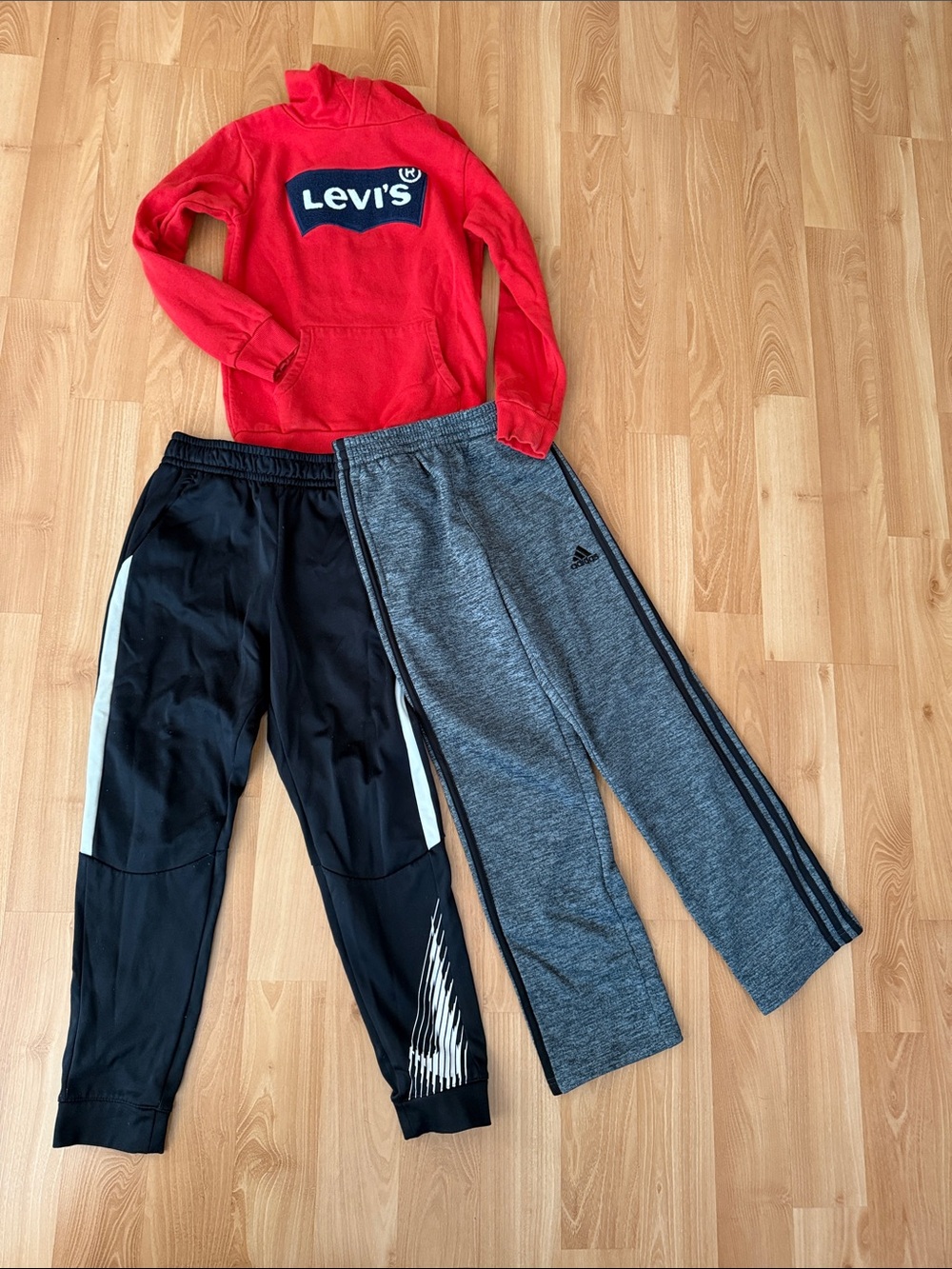 A bundle of Levi's Red Hoodie with Black and Gray Kids Joggers